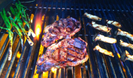 Steak and scallions on the grill