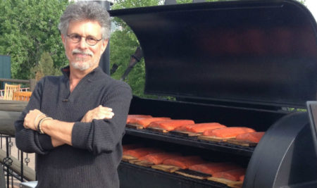 Steven Raichlen with salmon on smoker