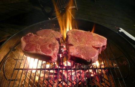 Porterhouse steaks on grill