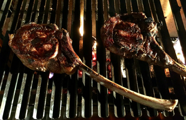 Tomahawk steaks on grill
