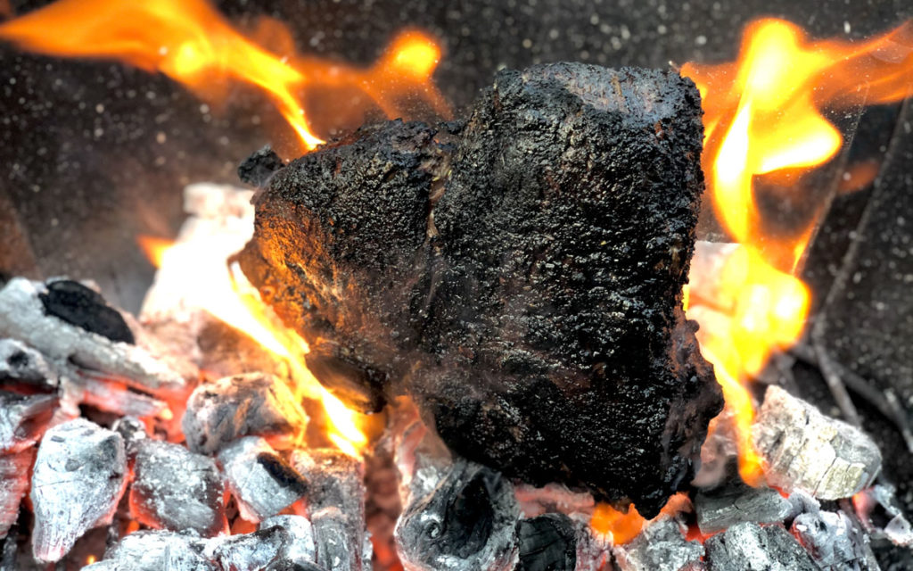 Caveman steak on coals
