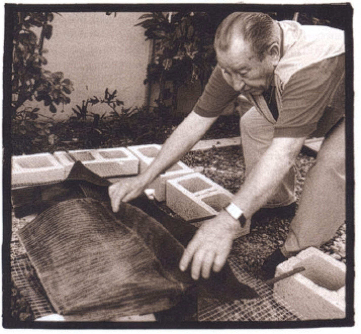 Banana leaves are placed over the pig to hold in the smoke and moisture.