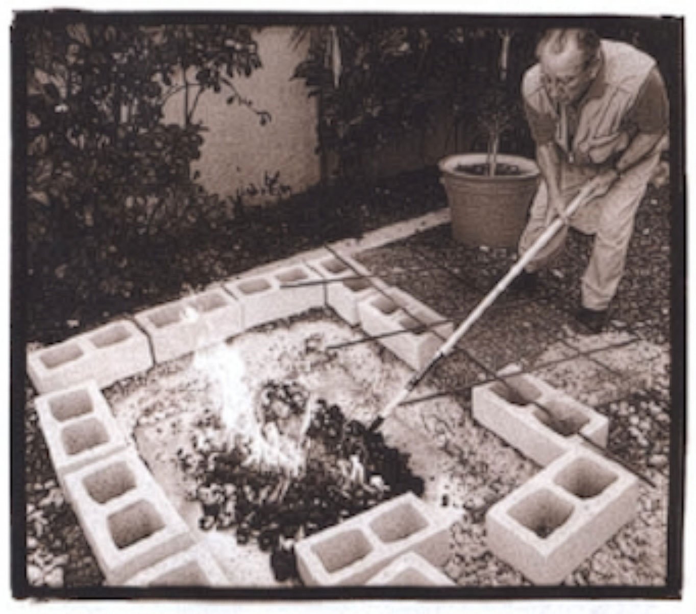 Bullding the pit with cinder blocks, chickon wire, and rebar.
