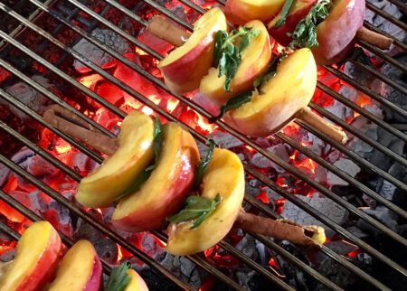 Cinnamon-grilled peaches with bourbon glaze and vanilla ice cream